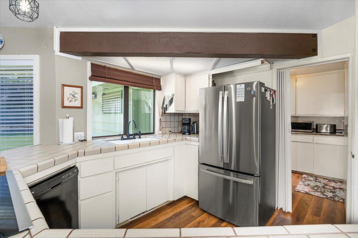 12325 Craig Avenue Red Bluff, CA 96080 - Photo 20 of 68 a kitchen with stainless steel appliances a refrigerator sink and cabinets