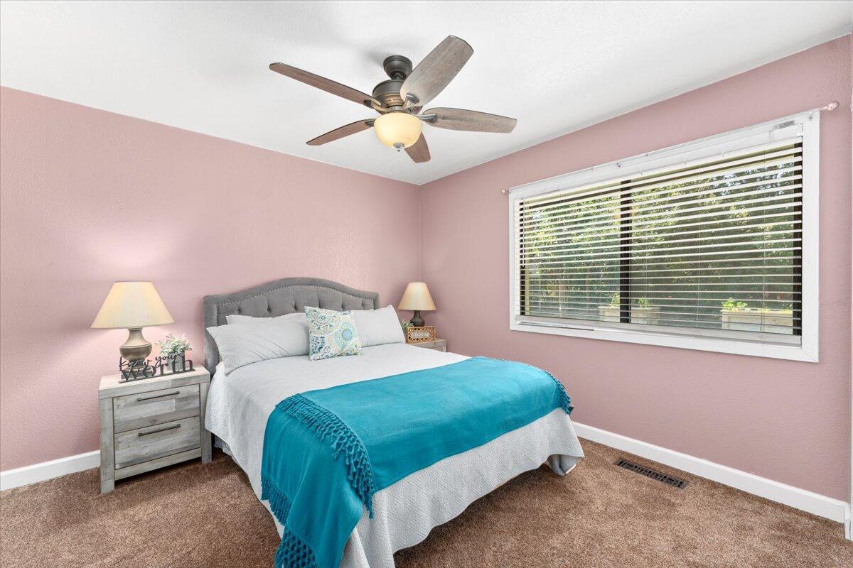 12325 Craig Avenue Red Bluff, CA 96080 - Photo 28 of 68 a bedroom with a bed and window