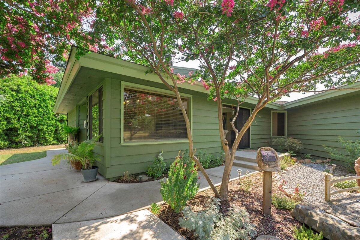12325 Craig Avenue Red Bluff, CA 96080 - Photo 40 of 68 a front view of a house with garden