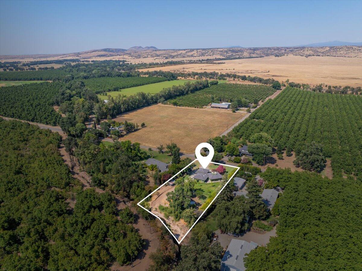 12325 Craig Avenue Red Bluff, CA 96080 - Photo 4 of 68 an aerial view of a house with a lake view