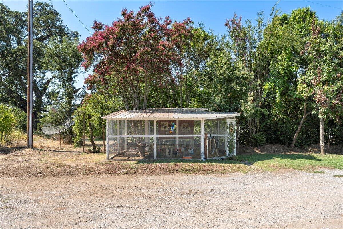12325 Craig Avenue Red Bluff, CA 96080 - Photo 46 of 68 a house with trees in the background