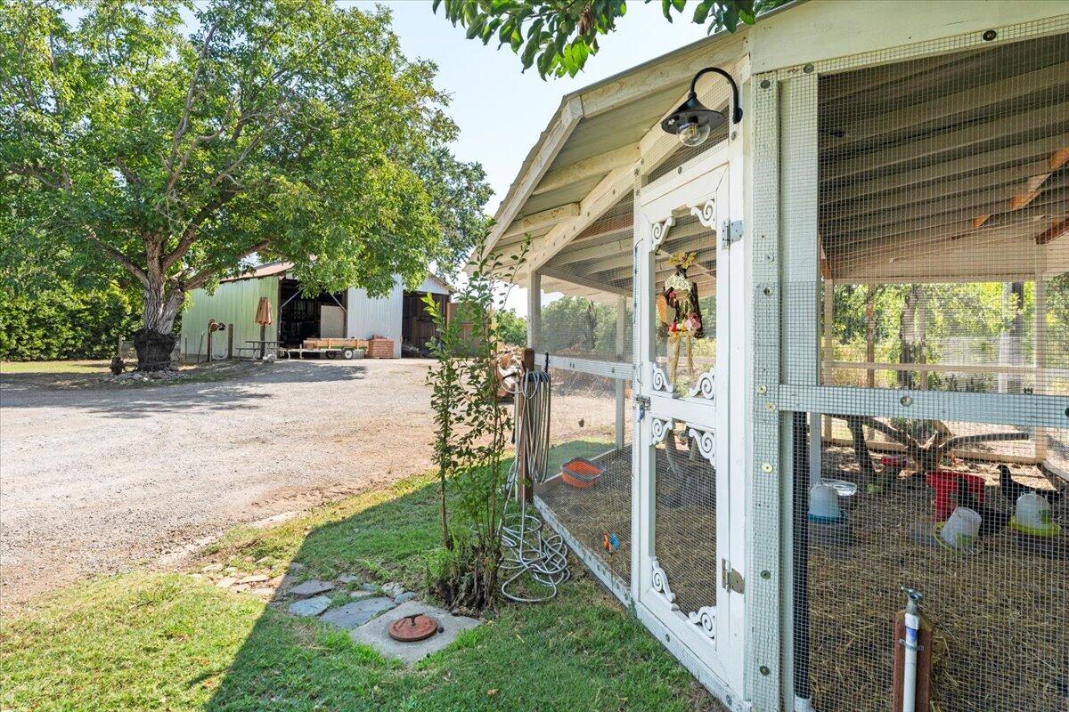 12325 Craig Avenue Red Bluff, CA 96080 - Photo 48 of 68 a view of a porch with furniture and garden