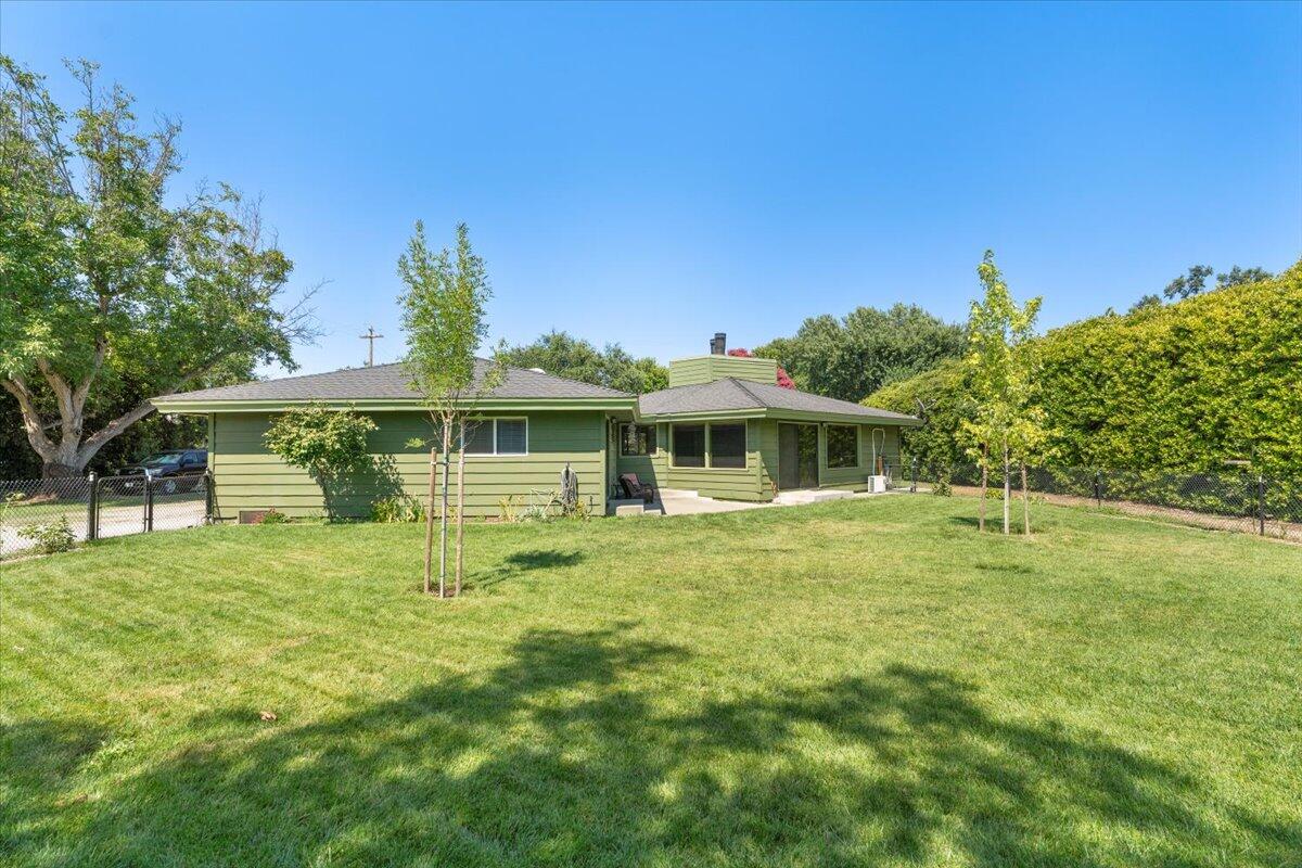 12325 Craig Avenue Red Bluff, CA 96080 - Photo 51 of 68 a front view of a house with a garden