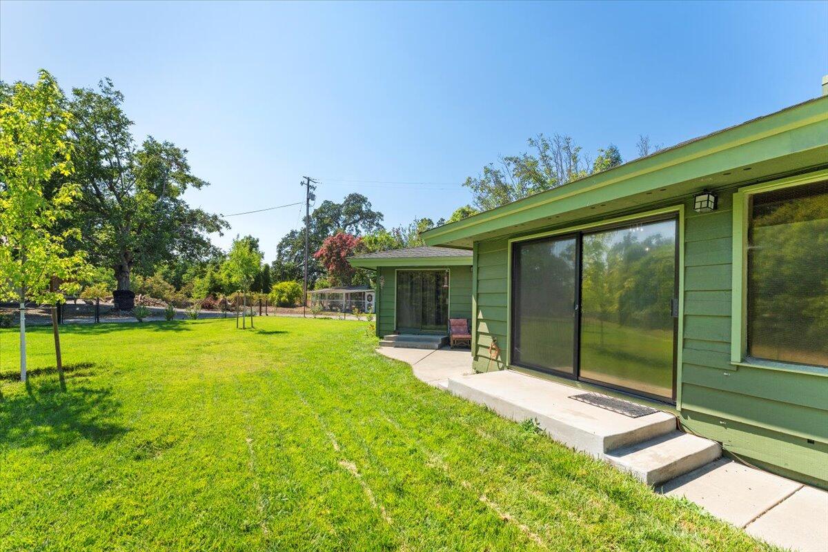 12325 Craig Avenue Red Bluff, CA 96080 - Photo 56 of 68 a view of a house with backyard and porch