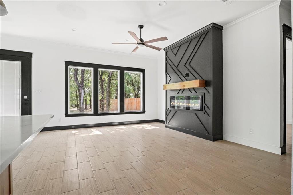 1791 JE Woody Road Springtown, TX 76082 - Photo 10 of 33 a view of an empty room with window and cabinet