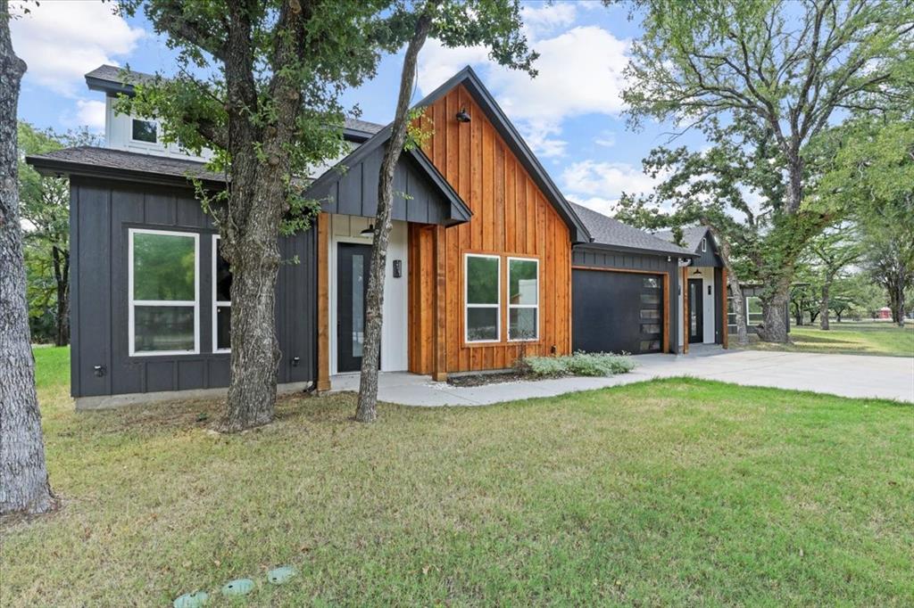 1791 JE Woody Road Springtown, TX 76082 - Photo 2 of 33 a front view of a house with a yard