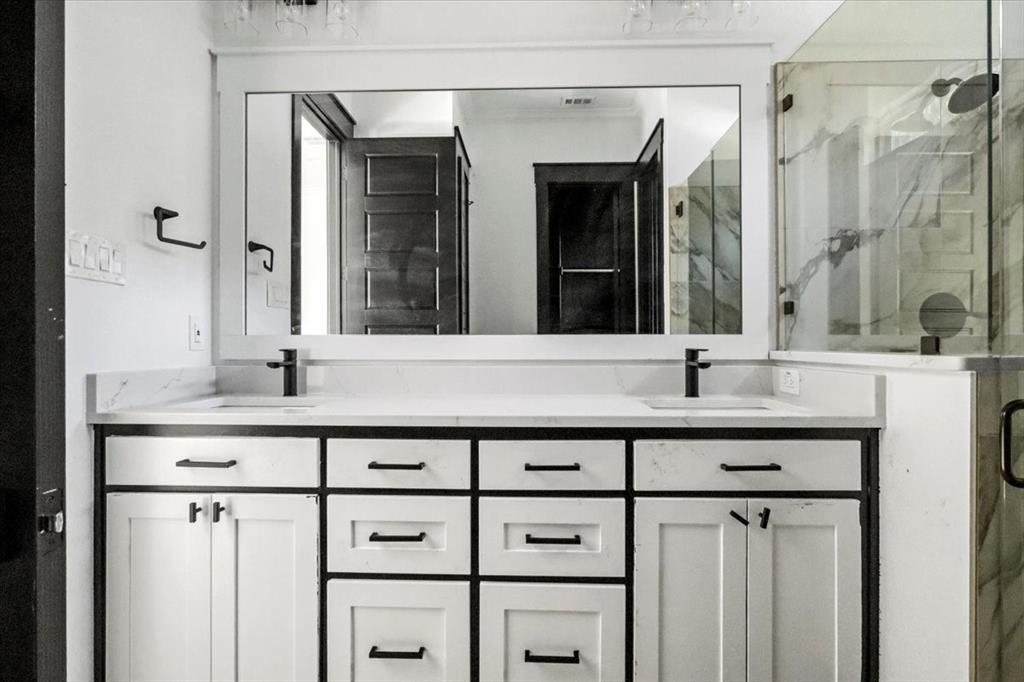 1791 JE Woody Road Springtown, TX 76082 - Photo 24 of 33 a bathroom with a sink and a mirror