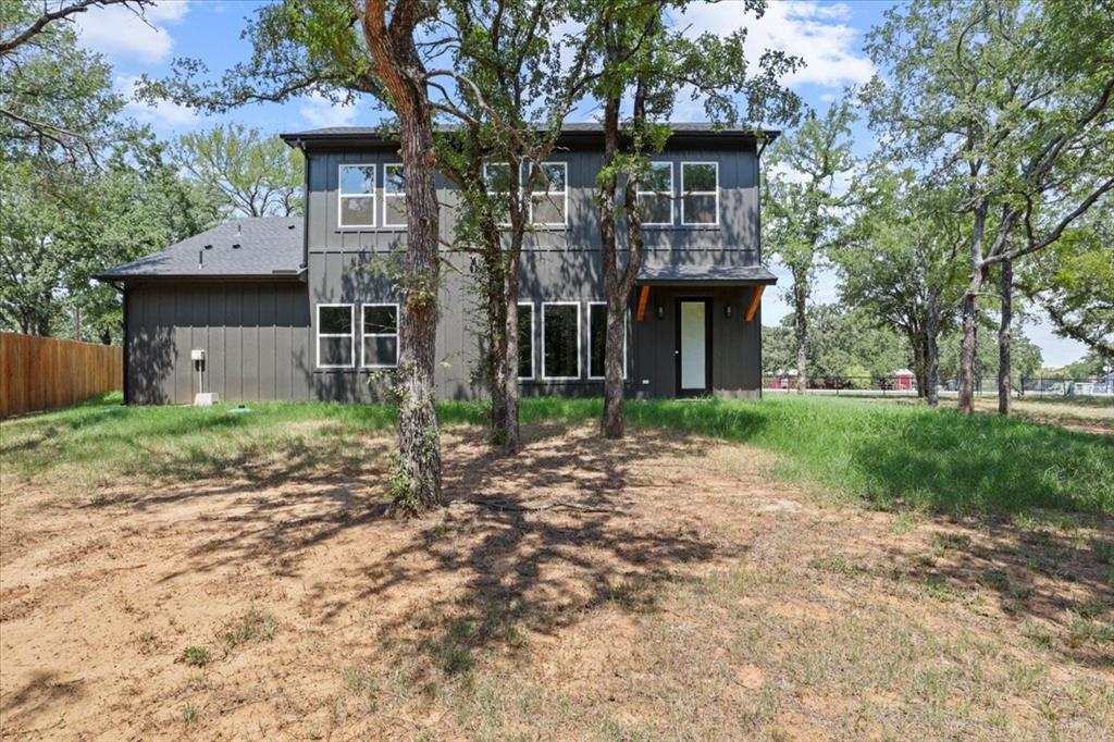 1791 JE Woody Road Springtown, TX 76082 - Photo 31 of 33 a front view of a house with garden