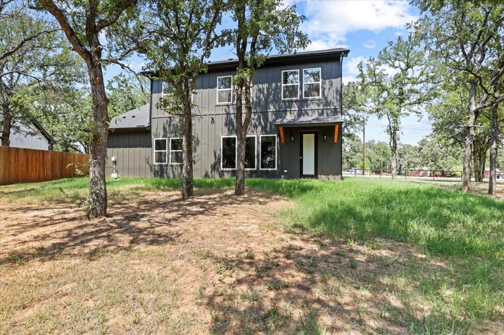 1791 JE Woody Road Springtown, TX 76082 - Photo 32 of 33 a front view of a house with garden