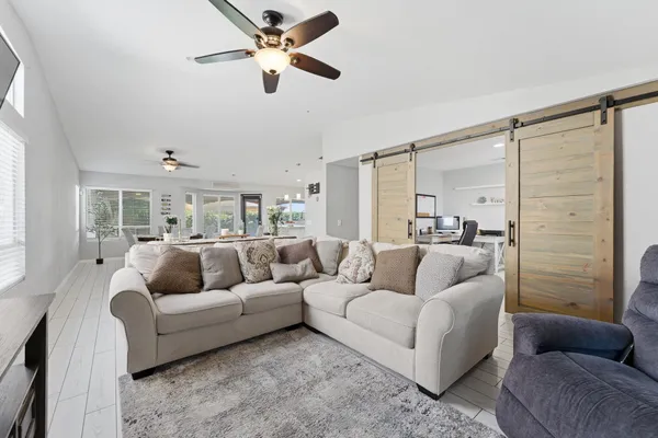 a kitchen with stainless steel appliances a stove microwave and a refrigerator