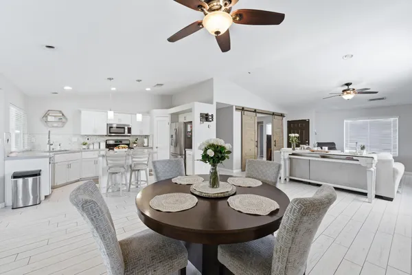 a view of a livingroom with furniture and a flat screen tv