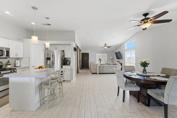 a view of a backyard with a patio and a garden