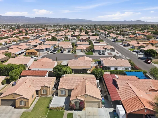 a view of a workspace with furniture and wooden floor