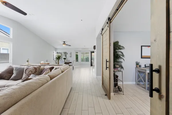 a kitchen with stainless steel appliances kitchen island granite countertop a sink and cabinets