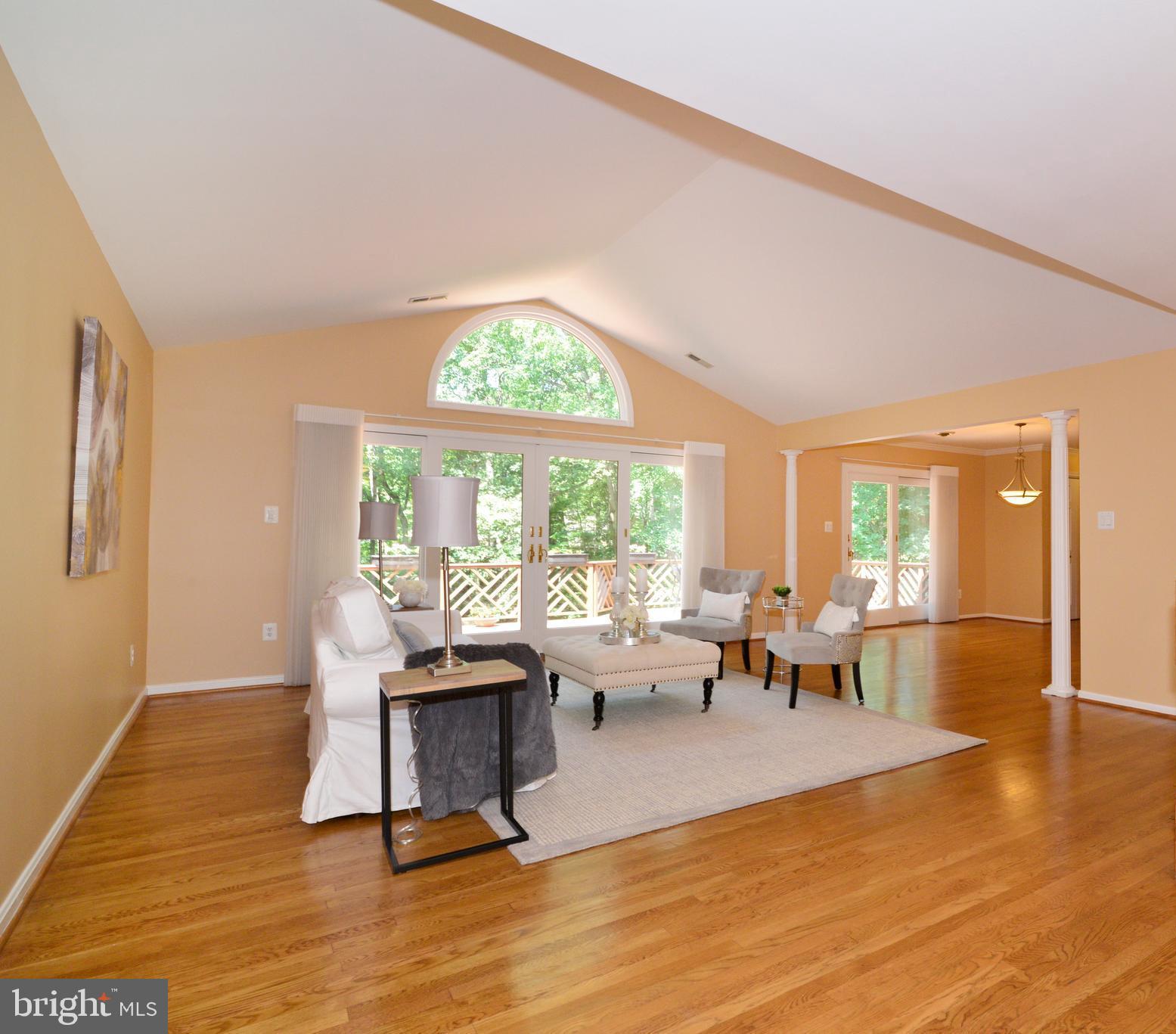 Living Room with high ceilings and natural light!