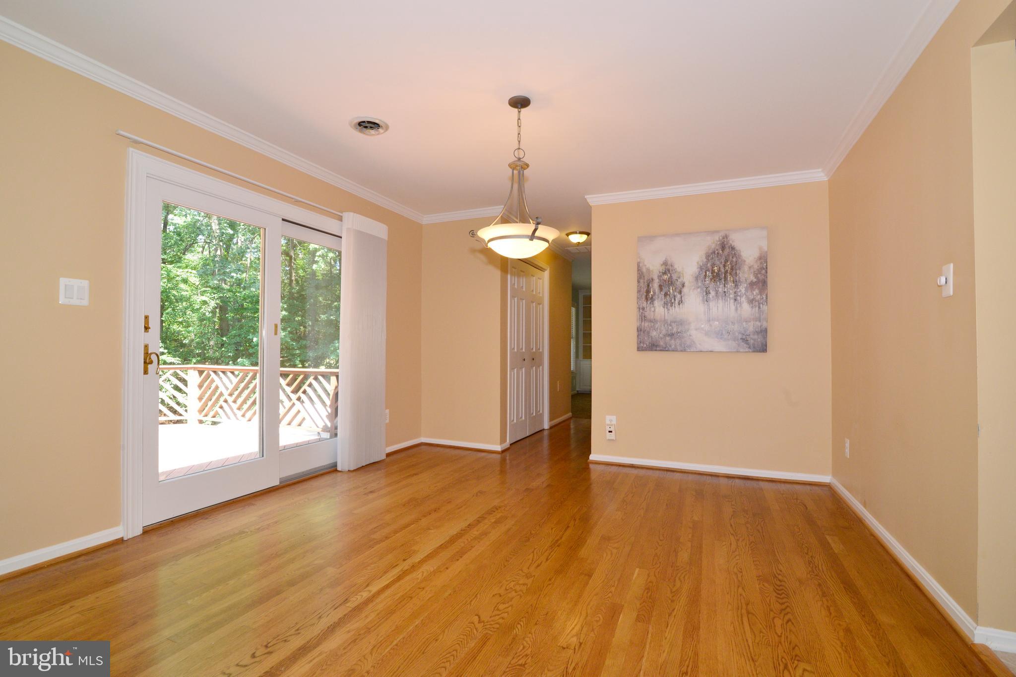 Dining Room w/ hardwoods and view