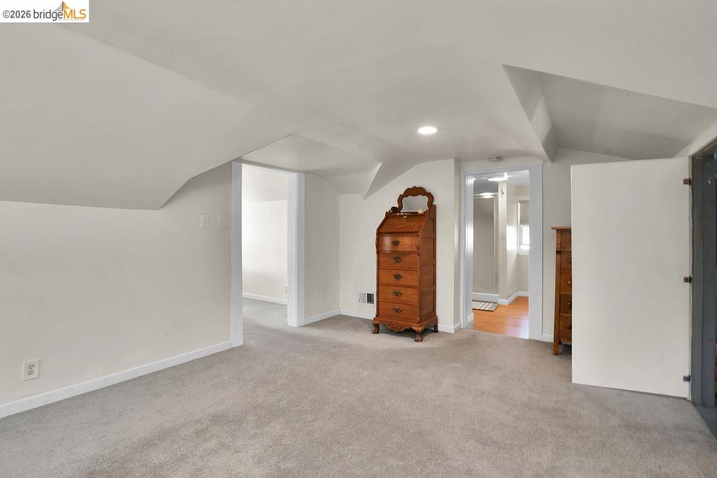 325 South 2nd Street Rio Vista, CA 94571 - Photo 20 of 33 Spacious room featuring sloped ceilings, recessed lighting, and soft carpet flooring