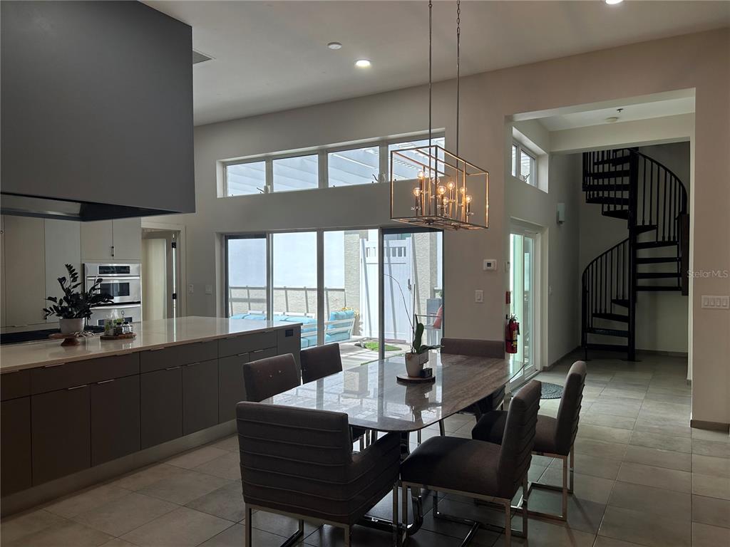 1345 2nd Street, Unit C Sarasota, FL 34236 - Photo 15 of 56 a view of a dining room with furniture window and outside view
