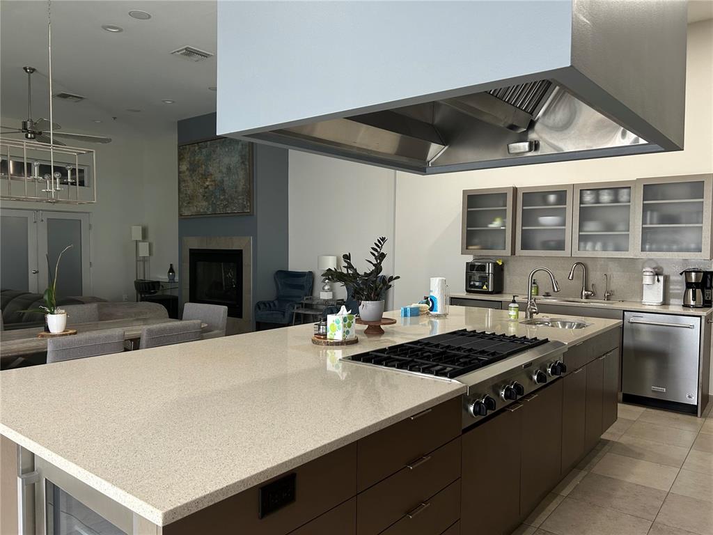 1345 2nd Street, Unit C Sarasota, FL 34236 - Photo 17 of 56 a kitchen with a stove a sink and a refrigerator