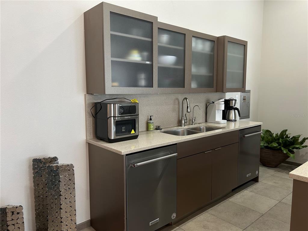 1345 2nd Street, Unit C Sarasota, FL 34236 - Photo 19 of 56 a kitchen with a sink and cabinets