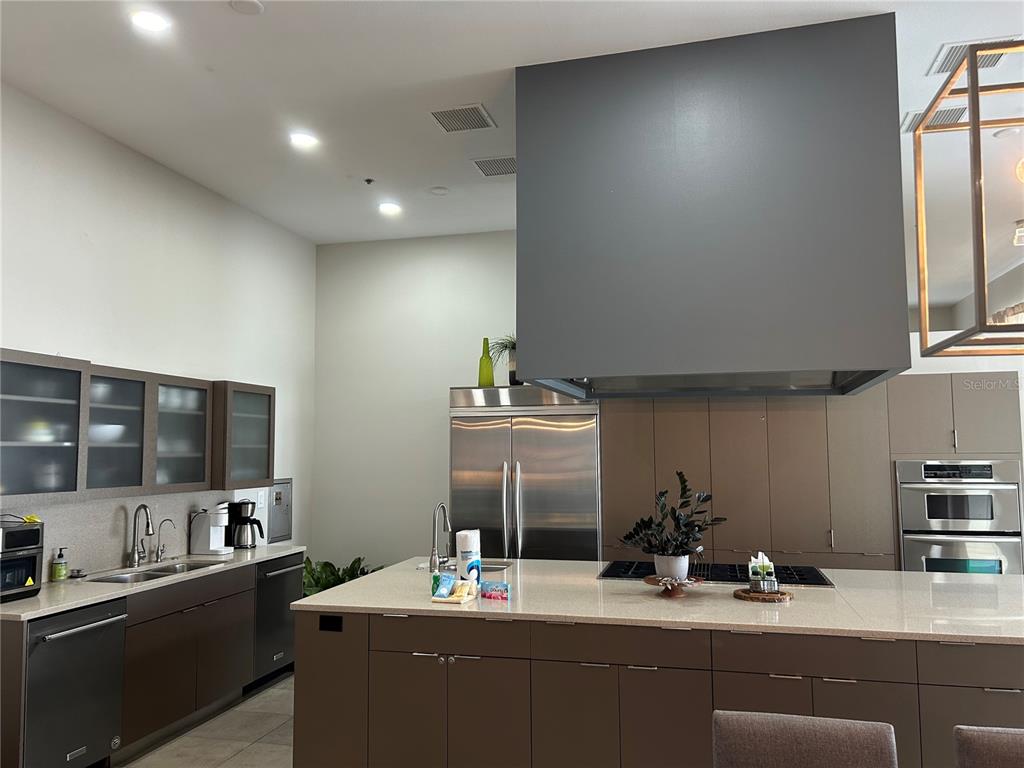 1345 2nd Street, Unit C Sarasota, FL 34236 - Photo 20 of 56 a kitchen with a sink cabinets and appliances