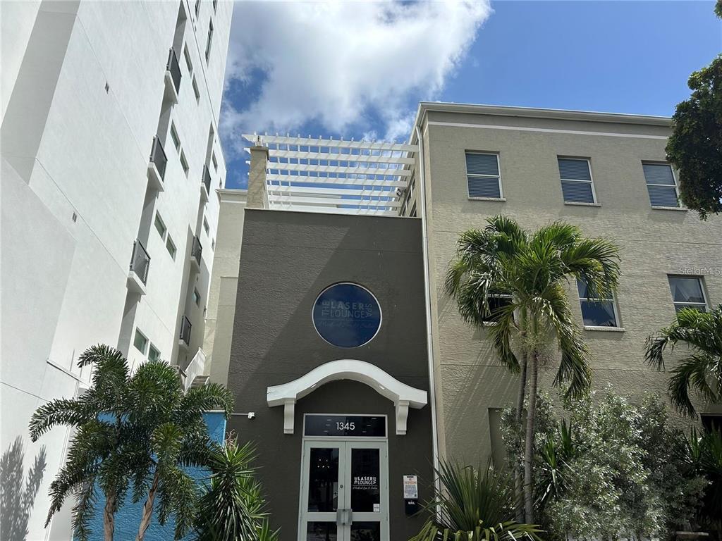 1345 2nd Street, Unit C Sarasota, FL 34236 - Photo 2 of 56 a front view of a house with a yard