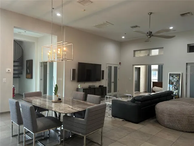 a room with a table and a fireplace