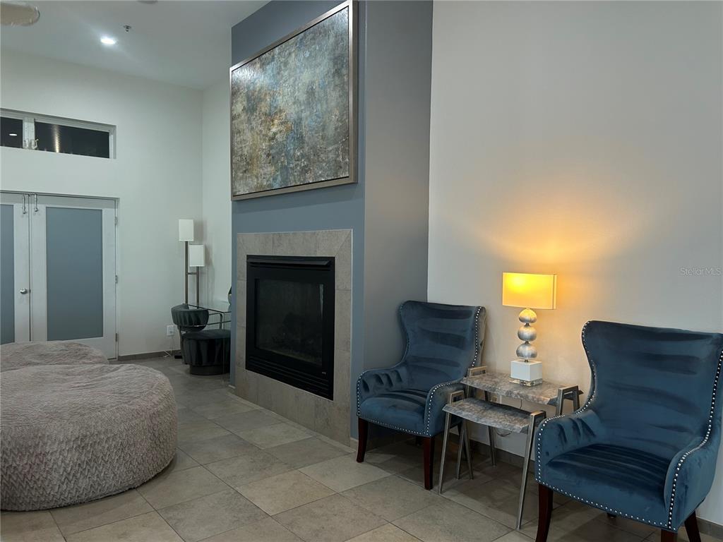 1345 2nd Street, Unit C Sarasota, FL 34236 - Photo 26 of 56 a bedroom with a bed and a chair