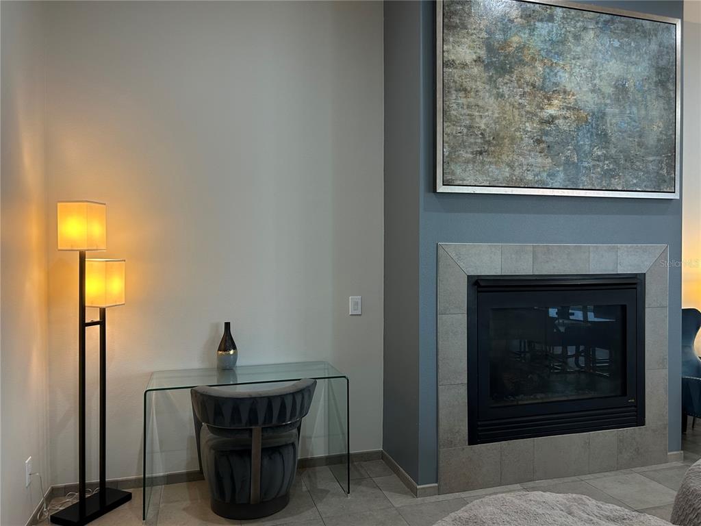 1345 2nd Street, Unit C Sarasota, FL 34236 - Photo 27 of 56 a room with a table and a fireplace