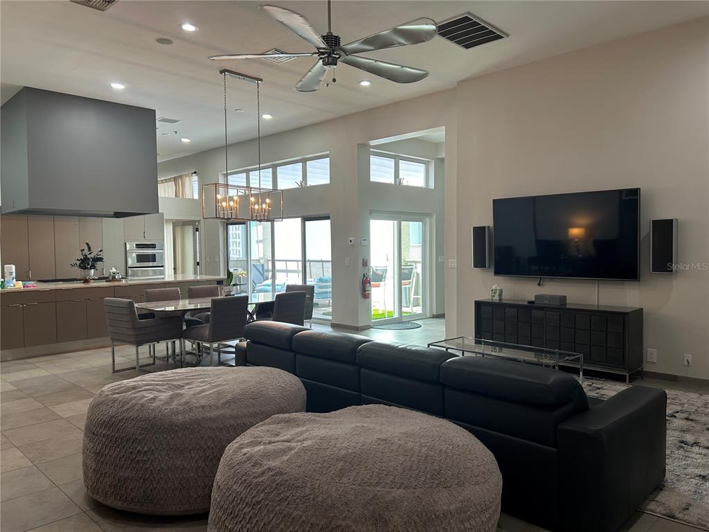 1345 2nd Street, Unit C Sarasota, FL 34236 - Photo 29 of 56 a living room with furniture and a flat screen tv