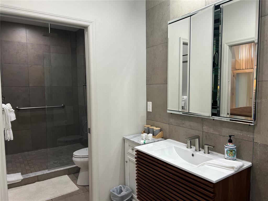 1345 2nd Street, Unit C Sarasota, FL 34236 - Photo 35 of 56 a bathroom with a sink a toilet and shower