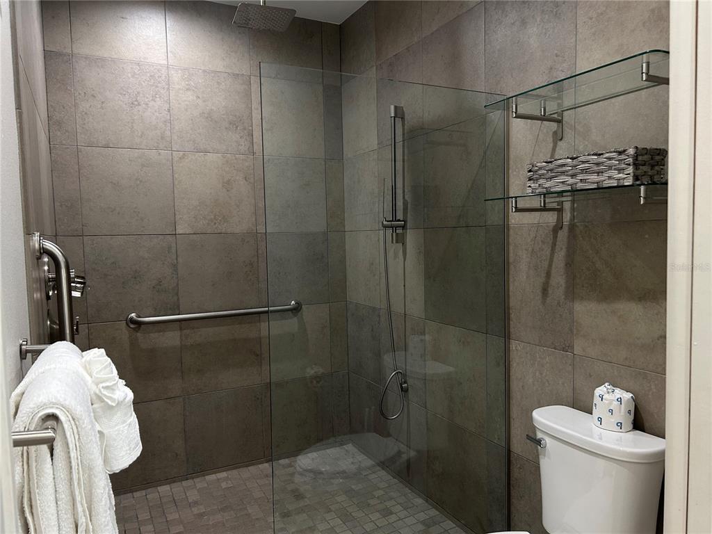 1345 2nd Street, Unit C Sarasota, FL 34236 - Photo 36 of 56 a bathroom with a shower and toilet