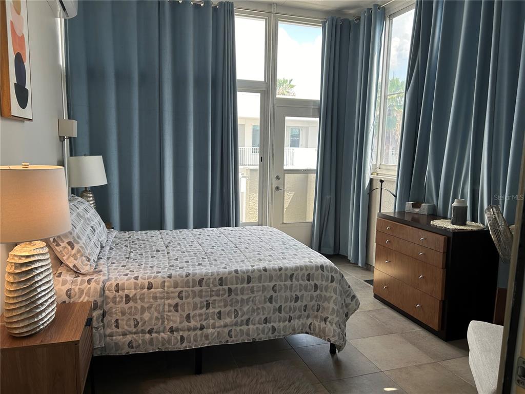 1345 2nd Street, Unit C Sarasota, FL 34236 - Photo 37 of 56 a bedroom with a bed and a window