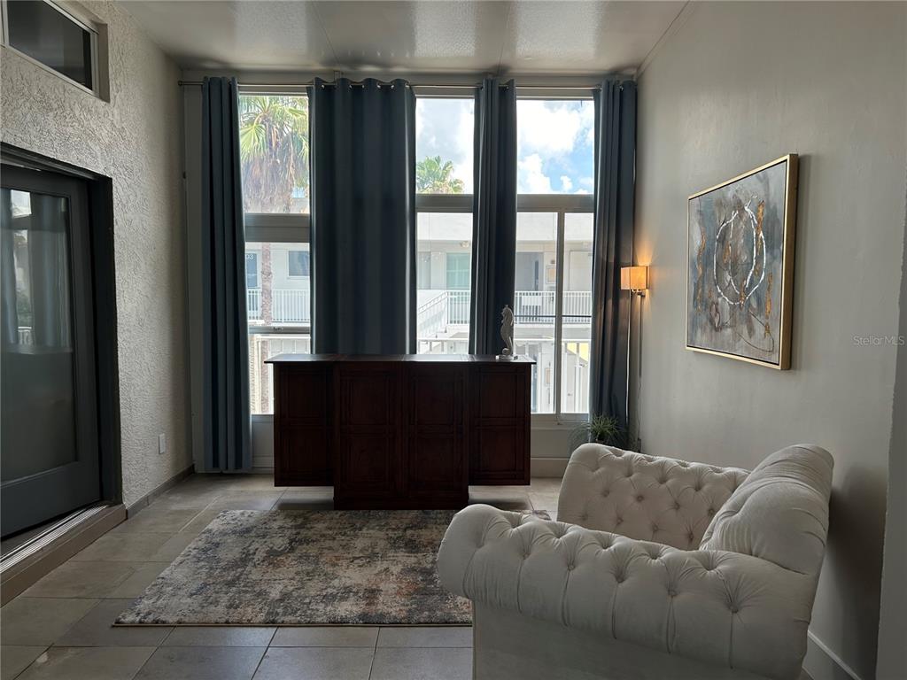 1345 2nd Street, Unit C Sarasota, FL 34236 - Photo 40 of 56 a living room with furniture and a window