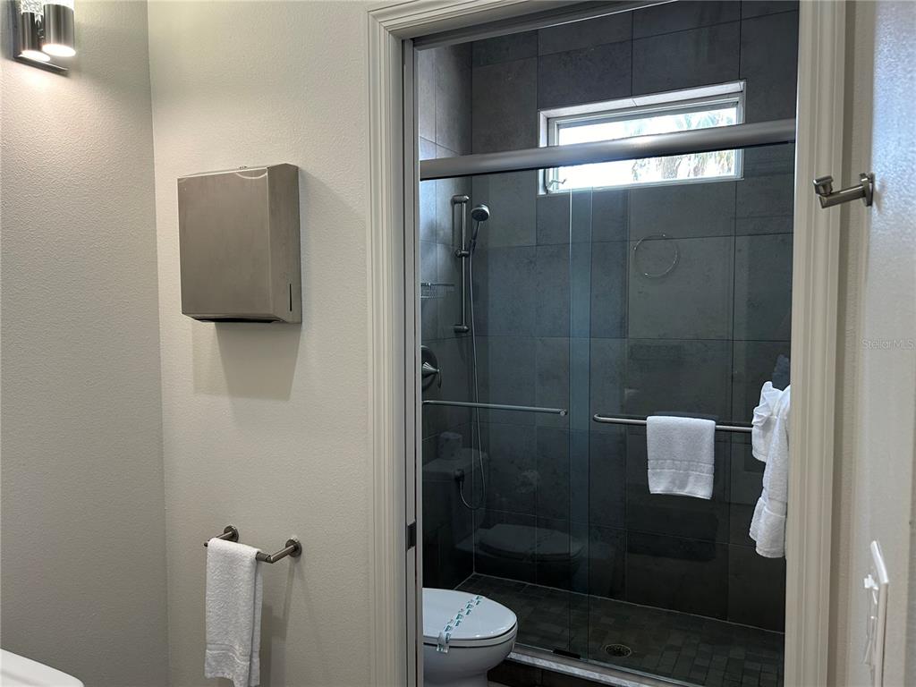 1345 2nd Street, Unit C Sarasota, FL 34236 - Photo 45 of 56 a bathroom with a shower and toilet
