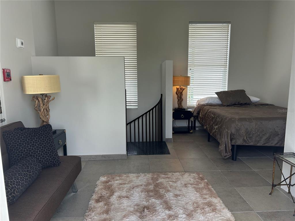 1345 2nd Street, Unit C Sarasota, FL 34236 - Photo 47 of 56 a bedroom with furniture and a window