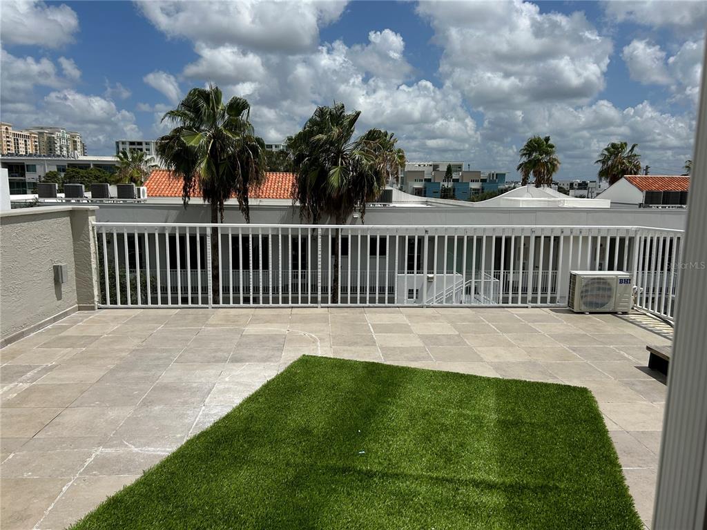 1345 2nd Street, Unit C Sarasota, FL 34236 - Photo 50 of 56 a view of a backyard with a garden