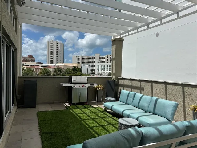 a kitchen with a sink and stove top oven