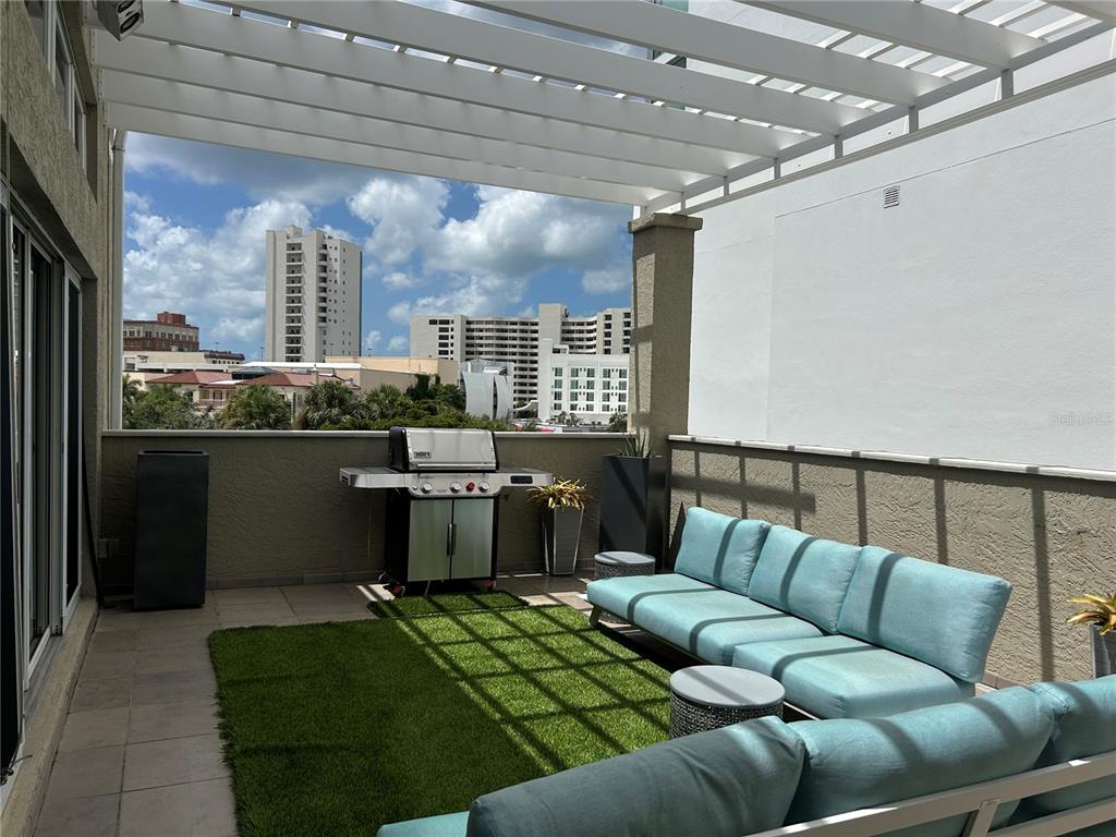 1345 2nd Street, Unit C Sarasota, FL 34236 - Photo 10 of 56 a living room with a couch and a table