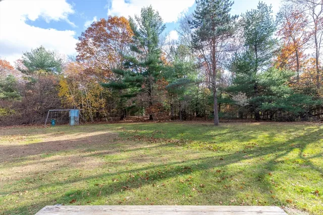 a view of a playground with basketball court