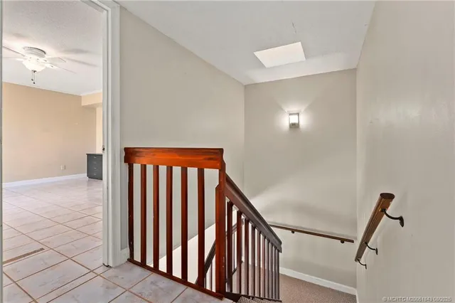 a view of a hallway with stairs