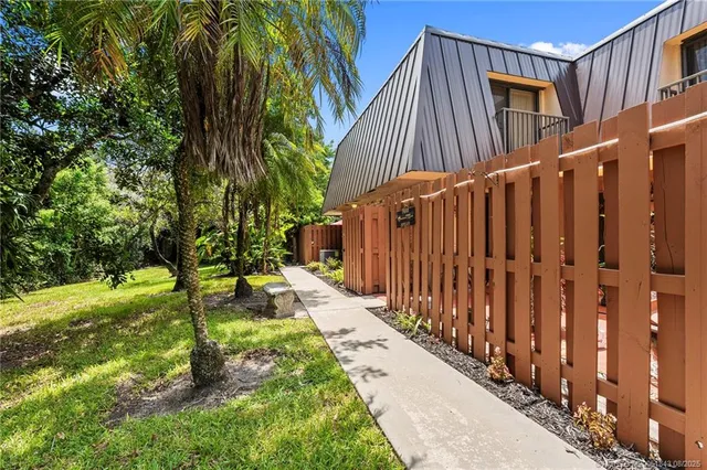 a view of a backyard with pathway