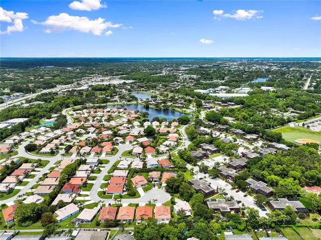an aerial view of residential houses with outdoor space