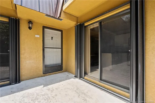a view of a bathroom with a glass door