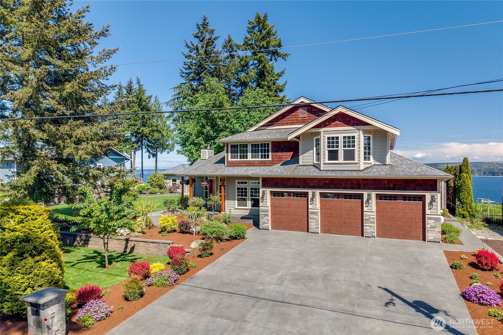 1411 Thorndyke Road Port Ludlow, WA 98365 - Photo 1 of 40 a front view of a house with a yard
