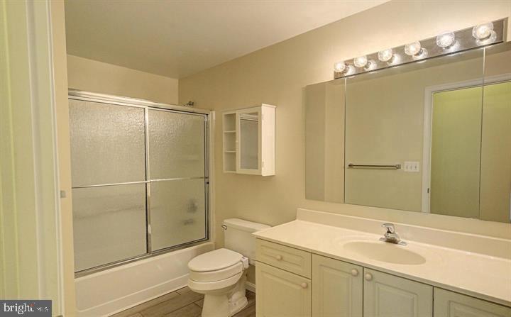 3200 North Leisure World Boulevard, Unit 203 Silver Spring, MD 20906 - Photo 12 of 32 a bathroom with a sink toilet and shower