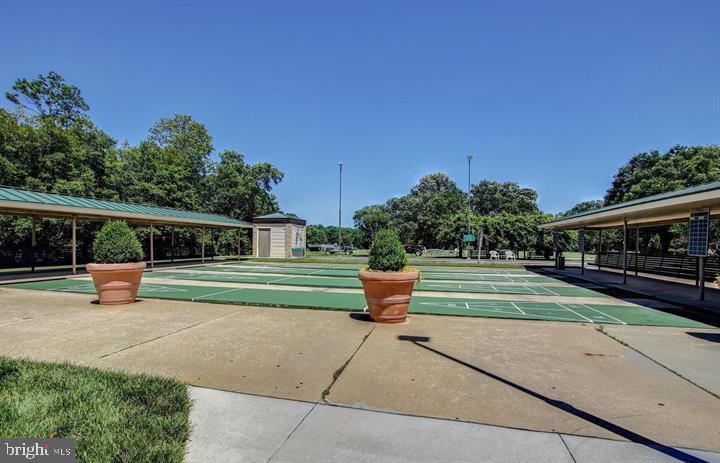 3200 North Leisure World Boulevard, Unit 203 Silver Spring, MD 20906 - Photo 28 of 32 a garden view with a seating space and fir pit