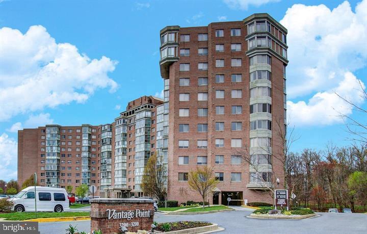 3200 North Leisure World Boulevard, Unit 203 Silver Spring, MD 20906 - Photo 32 of 32 a view of a tall building next to a city view