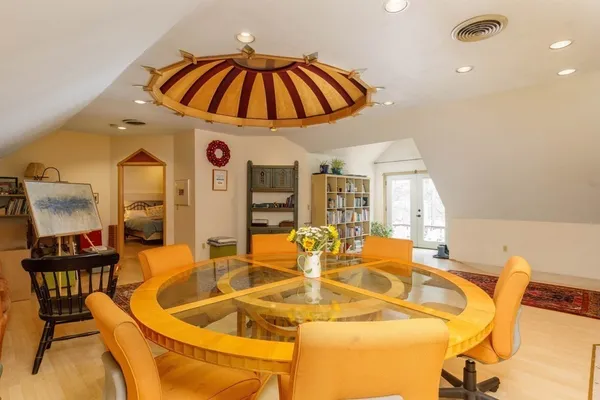 a view of a dining room with furniture and chandelier