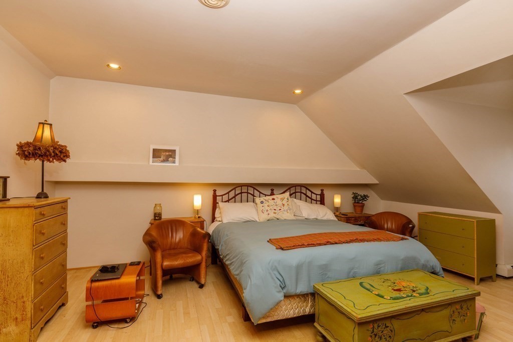 14 Travers Street Gardner, MA 01440 - Photo 6 of 17 a bed room with a bed and a lamp